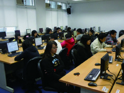 Students learning in computer class