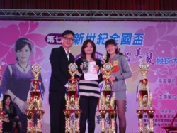 Students hold the champion's trophy at the 2013 New Century National Beauty and Hairdressing Competition